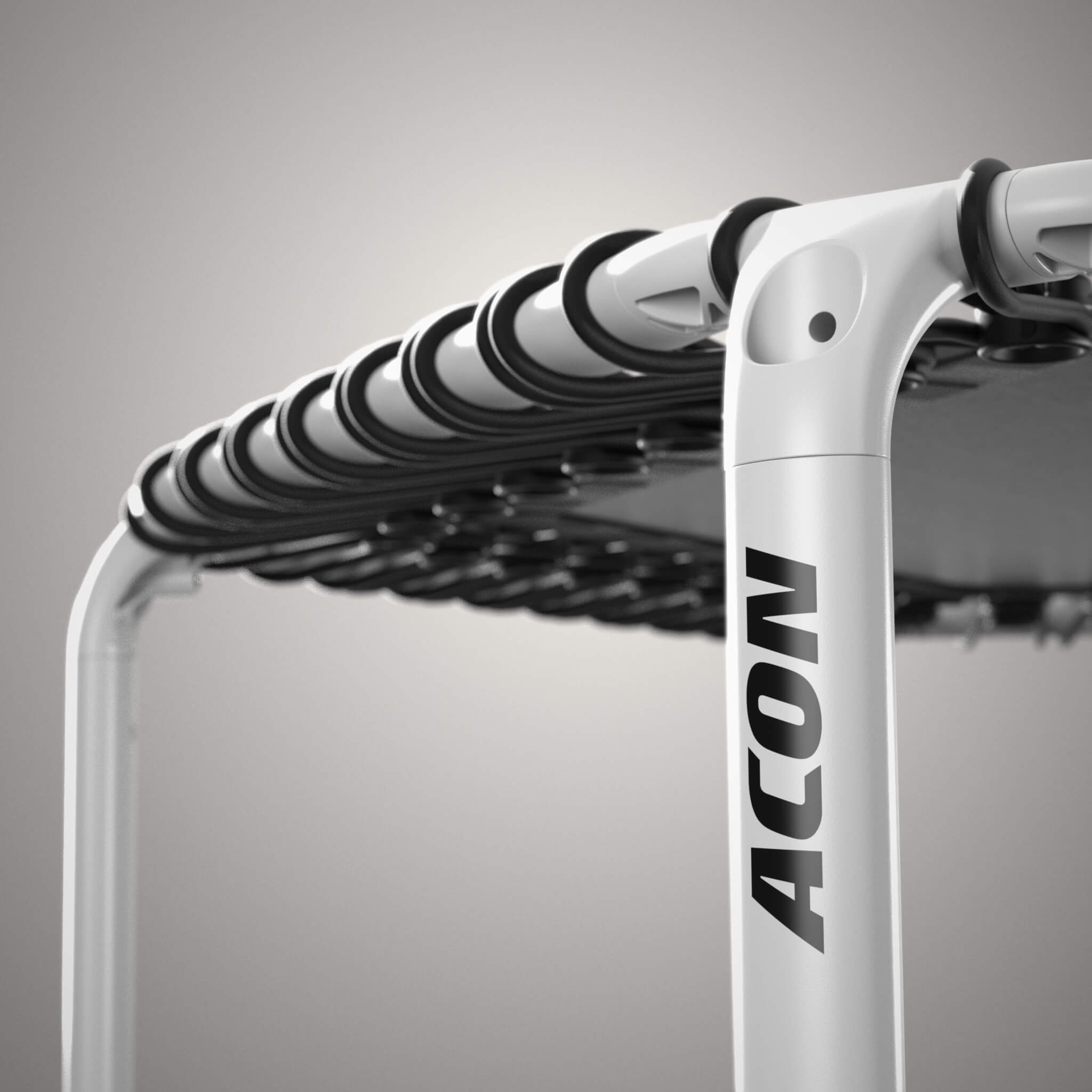 Gros plan sur un trampoline Acon FIT blanc et hexagonal.